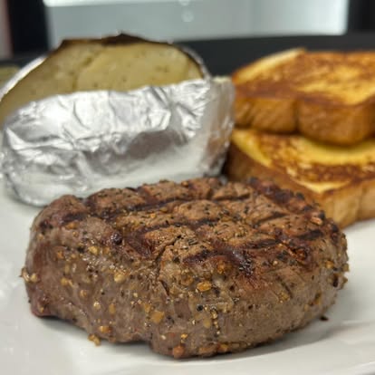 Grilled filet with a baked potato and Texas toast